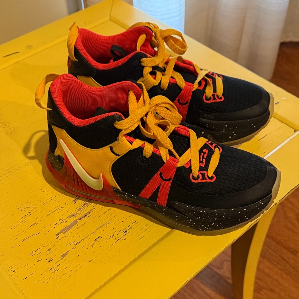 Nike Kids Black and Red Sneakers with Yellow Accents